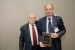 Dr. Nagib Callaos, General Chair, giving Prof. Oleg I. Redkin a plaque "In Appreciation for Delivering a Great Keynote Address at a Plenary Session."